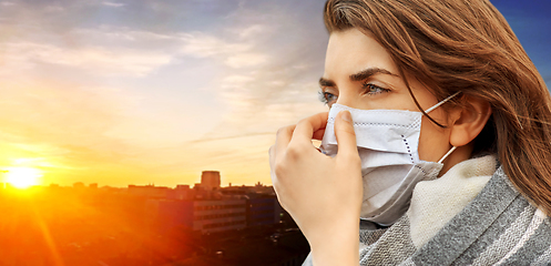 Image showing young woman wearing protective medical mask