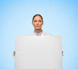 Image showing female doctor or scientist holding white board