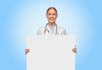 Image showing happy smiling female doctor holding white board