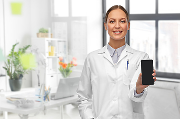 Image showing smiling female doctor with smartphone at hospital