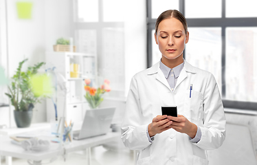 Image showing female doctor with smartphone at hospital