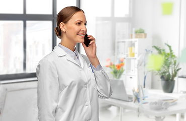 Image showing female doctoror calling on smartphone at hospital