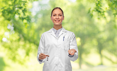 Image showing doctor with medicine and glass of water