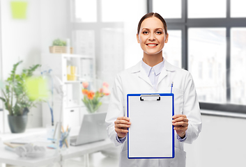 Image showing smiling female doctor with clipboard at hospital