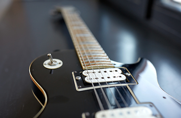 Image showing close up of bass guitar strings on windowsill