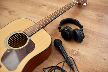 Image showing close up of guitar, microphone and headphones