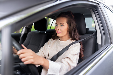 Image showing woman or female driver driving car in city