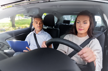 Image showing car driving school instructor and young driver