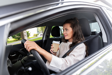 Image showing woman or female driver with coffee driving car