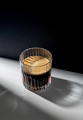 Image showing glass of coffee on table