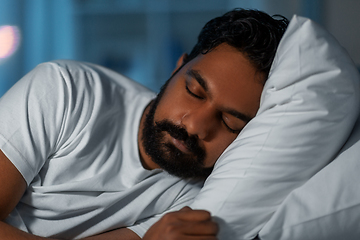 Image showing indian man sleeping in bed at home at night