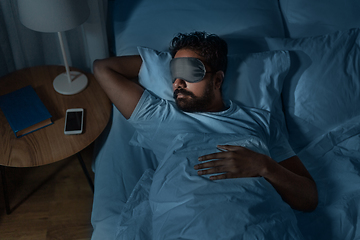 Image showing indian man sleeping in bed at home at night