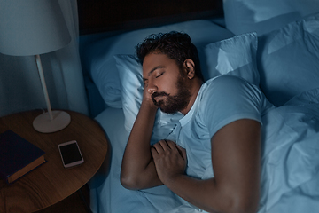 Image showing indian man sleeping in bed at home at night