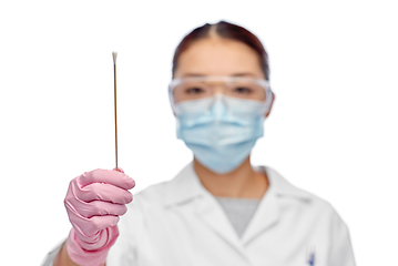 Image showing asian female doctor in mask with test cotton swab
