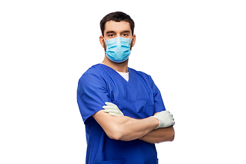 Image showing male doctor in blue uniform, mask and gloves