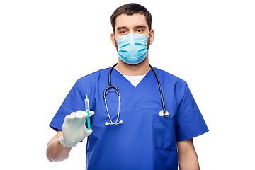 Image showing male doctor in mask and gloves with syringe