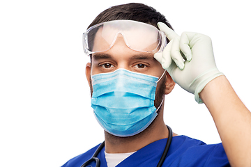 Image showing male doctor in goggles, mask and gloves