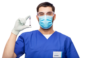 Image showing male doctor in mask with blood in test tube