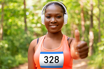 Image showing happy female marathon runner with headphones