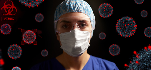 Image showing female doctor or nurse in goggles and face mask