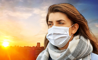 Image showing young woman wearing protective medical mask