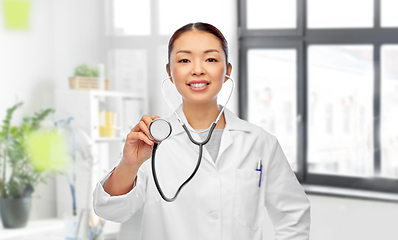 Image showing close up of asian female doctor with stethoscope