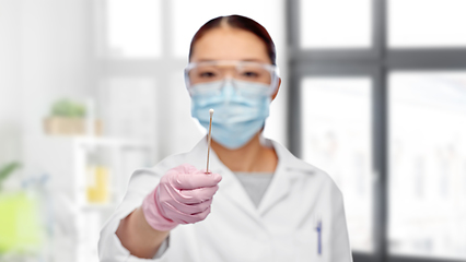 Image showing asian female doctor in mask with test cotton swab
