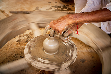 Image showing Potter at work makes ceramic dishes. India, Rajasthan.