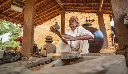 Image showing Potter at work makes ceramic dishes. India, Rajasthan.