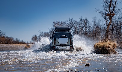 Image showing Off road tourist car rides off-road in the highlands. Expedition