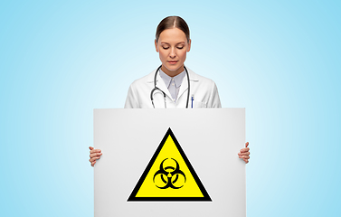 Image showing female doctor with biohazard sign over blue