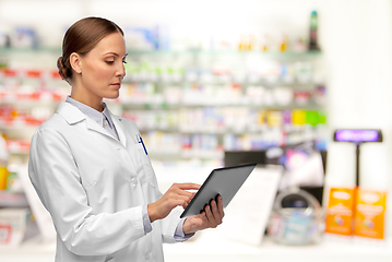 Image showing female doctor with tablet computer at pharmacy