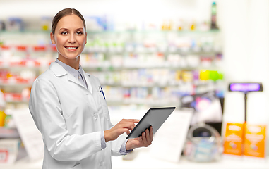 Image showing female doctor with tablet pc at pharmacy