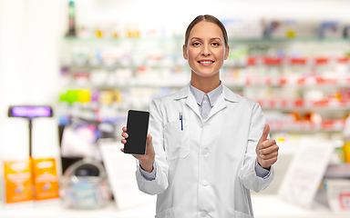 Image showing female doctor with smartphone showing thumbs up