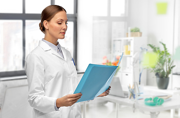 Image showing female doctor with folder at hospital