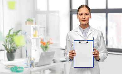 Image showing female doctor with clipboard at hospital