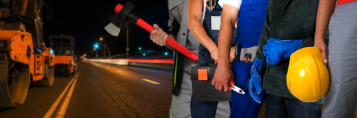 Image showing Builder workers with equipment repairing a road