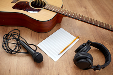 Image showing guitar, music book, microphone and headphones