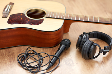 Image showing close up of guitar, microphone and headphones