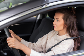 Image showing woman or female driver driving car in city