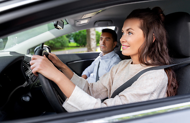 Image showing car driving school instructor teaching woman