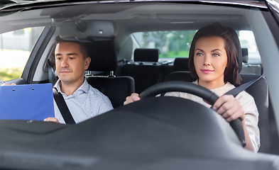 Image showing car driving school instructor and young driver