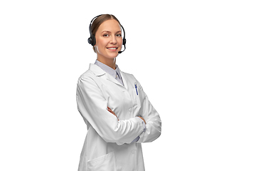 Image showing smiling female doctor in coat with headset