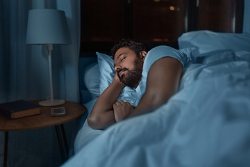 Image showing indian man sleeping in bed at home at night