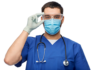 Image showing male doctor in goggles, mask and gloves