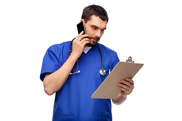 Image showing doctor or male nurse calling on smartphone