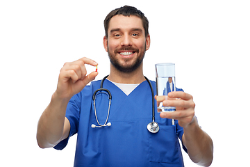 Image showing doctor or male nurse with medicine and water