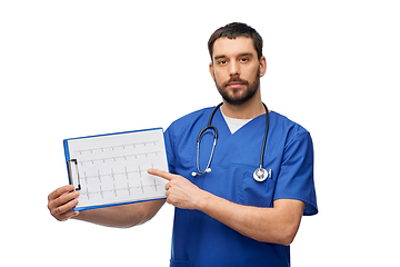 Image showing male doctor with cardiogram on clipboard