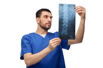 Image showing doctor or male nurse looking at x-ray scan