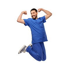 Image showing happy smiling doctor or male nurse jumping in air